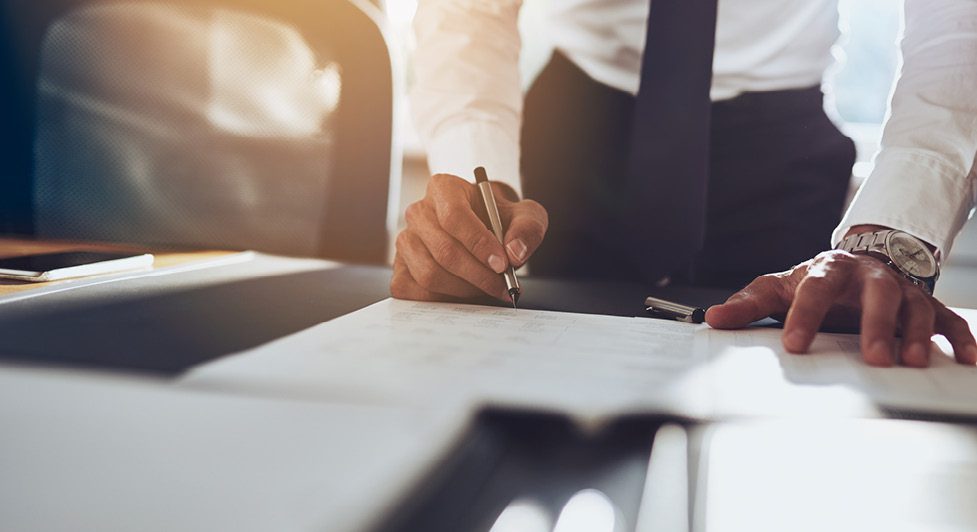 Man Signing Legal Document